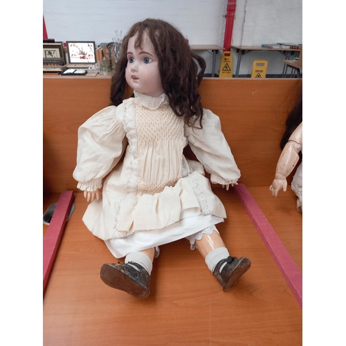 234 - A large antique doll (bisque head and composite body) (Marks 1907 and 15) measuring 32 inches tall