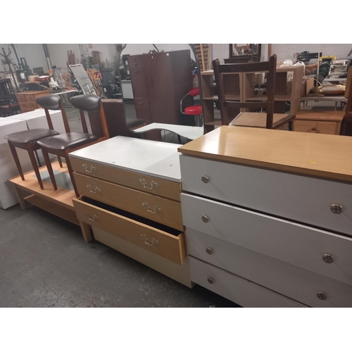 551 - A formica topped dressing table, coffee table two dining chairs and chest of drawer