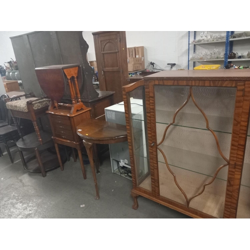 563 - A walnut glass fronted china cabinet, side tables, piano stool etc