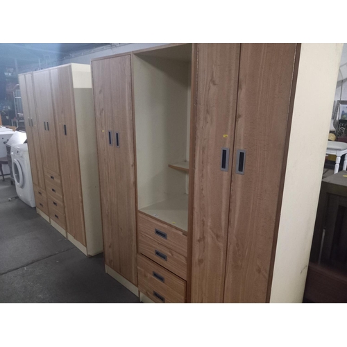 571 - Two sets of  David Backer three section triple wardrobes