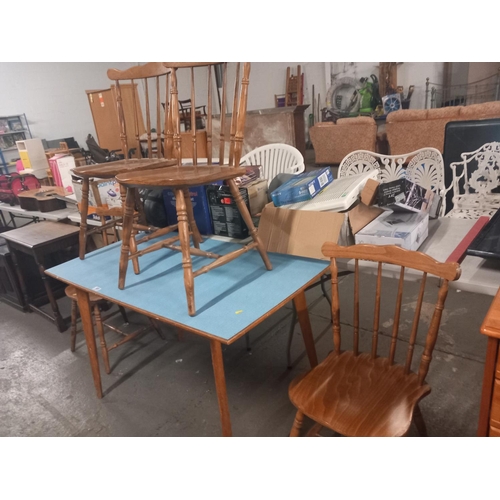 589 - A formica topped dining table and four oak chairs