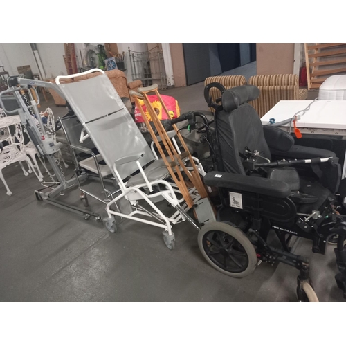 615 - Four mobility aids to include a Azlea Assist wheelchair, crutches, Intacare reliant 250 hoist and tw... 