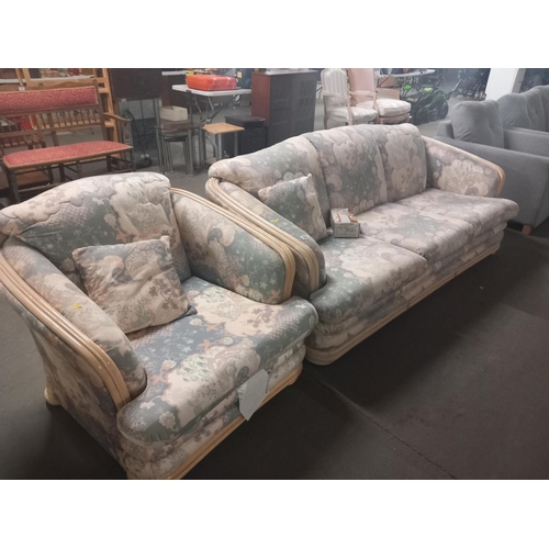 635 - A bamboo framed upholstered three seater sofa with matching armchair