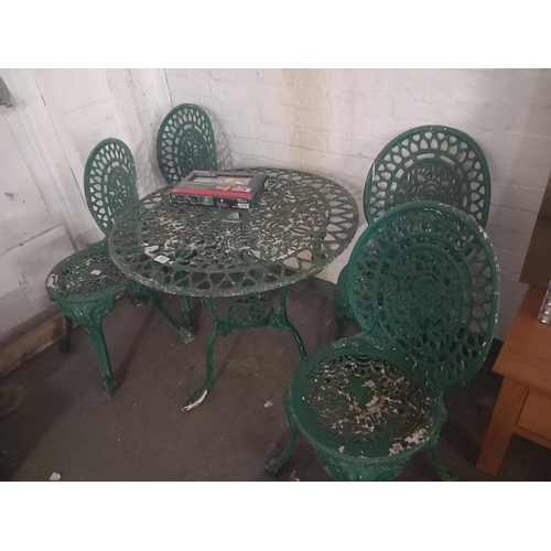 653 - Metal garden table and four chairs