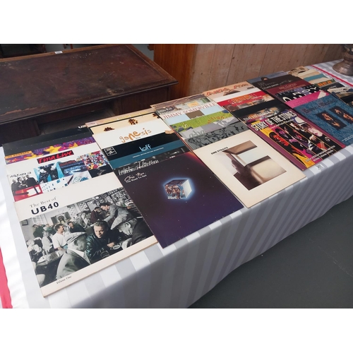 251 - A selection of vinyl records to include Genesis, UB40, Rolling Stones etc