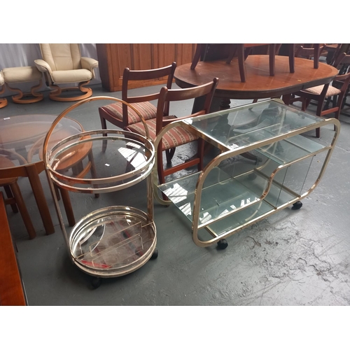 328 - A Mid century modern brass bar cart in the style of Milo Baughman together with a brass and glass it... 