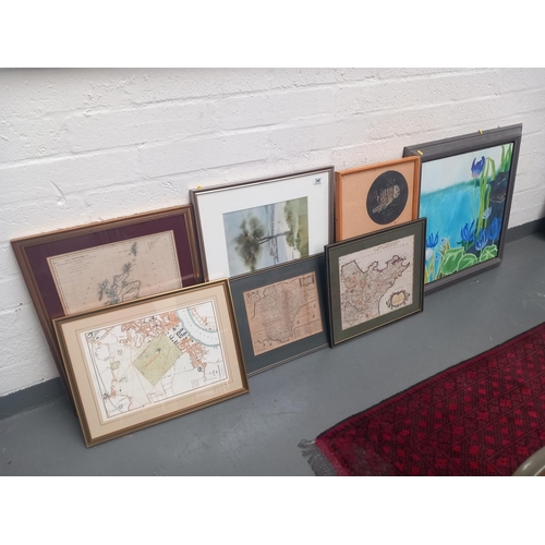 340 - Four framed maps, an oil on canvas and two other framed pictures