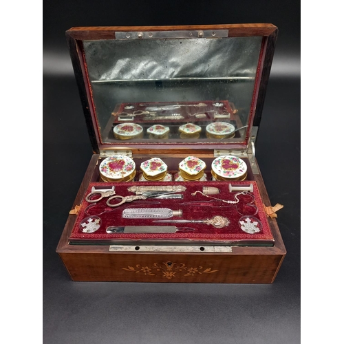 402 - An inlaid French sewing/vanity box opening to reveal a mirrored lid (crack to bottom corner) and a f... 