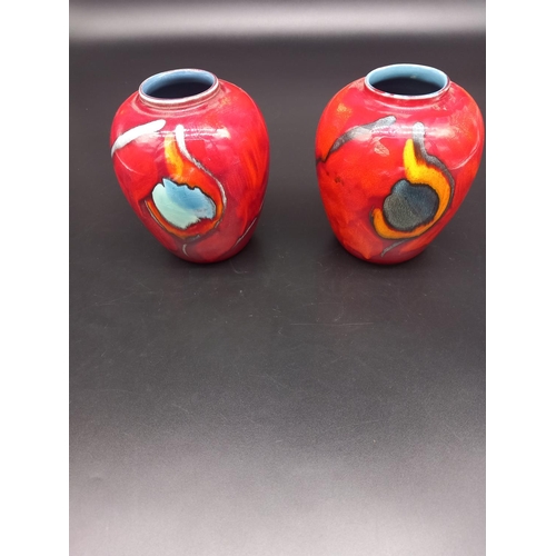 403 - Two Poole Pottery vases (6 inches tall)