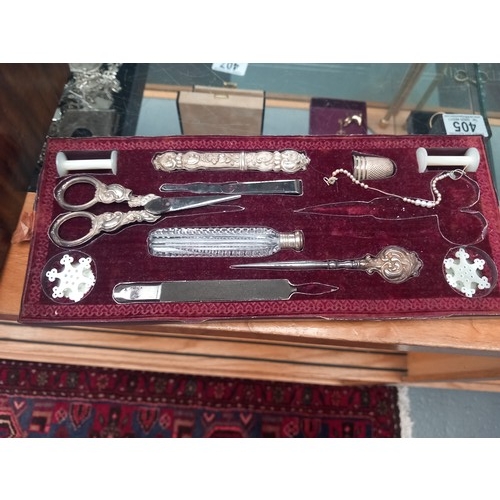 402 - An inlaid French sewing/vanity box opening to reveal a mirrored lid (crack to bottom corner) and a f... 