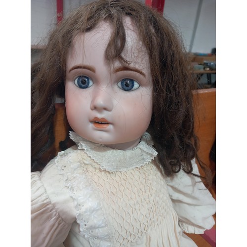 234 - A large antique doll (bisque head and composite body) (Marks 1907 and 15) measuring 32 inches tall