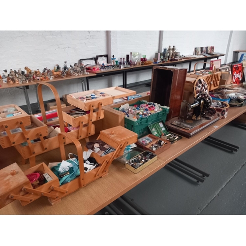 61 - A vintage Jones sewing machine together with sewing boxes, cottons and other sewing related items