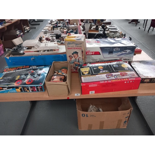 78 - Two radio controlled boats, boardgames and other games and a boxed vintage 