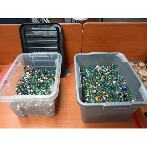 85 - Two large containers containing over a thousand marbles