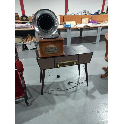 104 - A radiogram on dansette legs together with a gramaphone