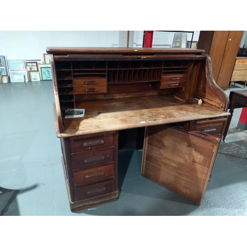 118 - A twin pedestal oak roll top desk