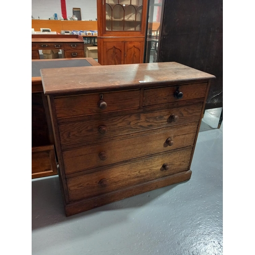 132 - An oak two over three chest of drawers