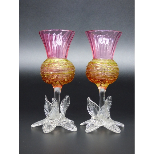 49 - A pair of Victorian pink thistle vases with yellow trails standing on a clear glass foot.

Height 14... 