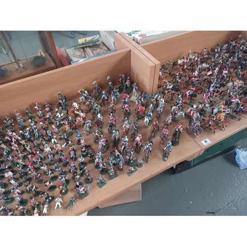49 - A large collectin of Delprado metal miltary figures - many being on horseback