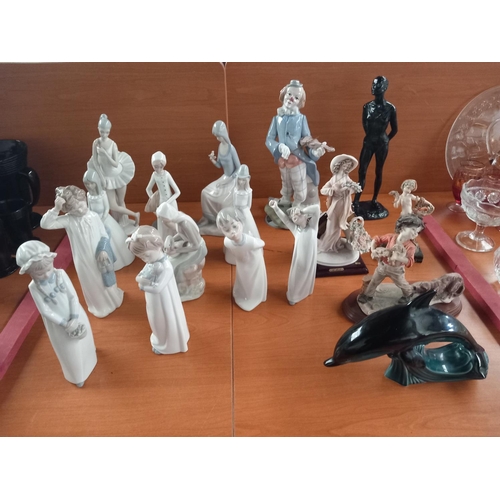 66 - A collection of figurines - Nao, Lladro and others