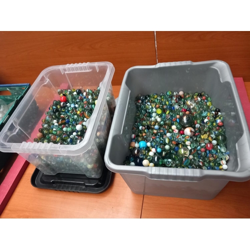 79 - Two large containers containing over a thousand marbles