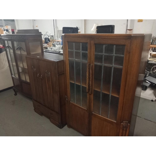 377 - Two glass fronted china cabinets together with an oak cupboard