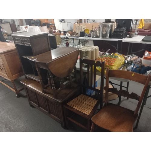 380 - An oak blanket box, drop leaf coffee table, oak cabinet together with two dining chairs