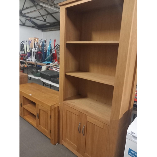 385 - An oak display cabinet together with a sideboard