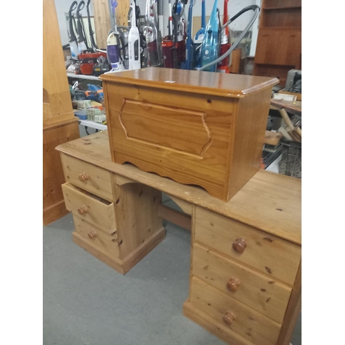 386 - A pine desk together with a pine blanket box