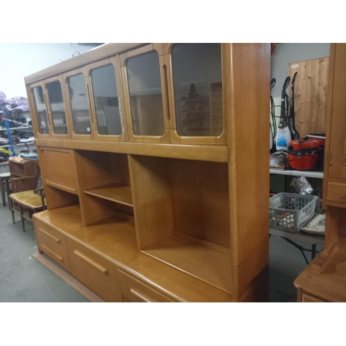 388 - A large three sectioned teak display cabinet