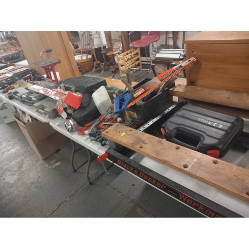 392 - A Black and Decker workmate together with hand tools, screwdriver sets, sanders, toolboxes etc