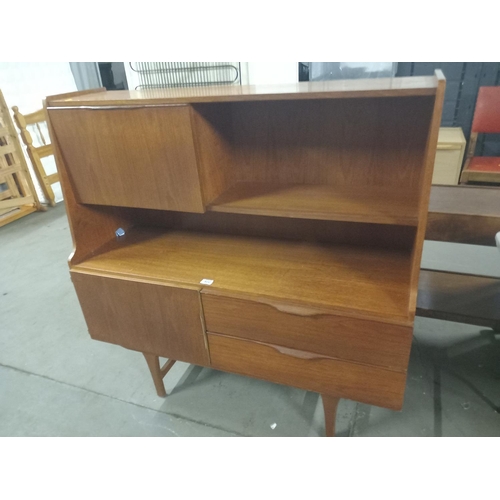 402 - A teak highboard