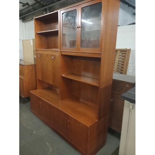 440 - A large teak wall unit