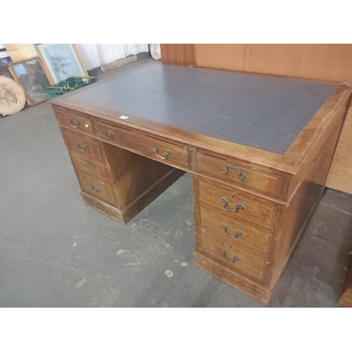 443 - A twin pedestal desk with leatherette insert