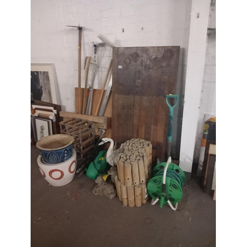 470 - Hose reels, wooden log roll, spades, plant pots, ornaments etc