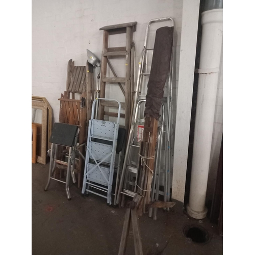 472 - A selection of wooden and aluminium ladders