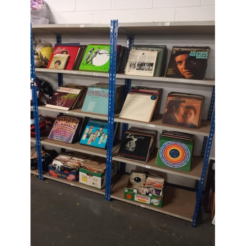 475 - 8 shelves of mixed genre vinyl records and singles