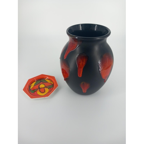 202 - A large black and orange Poole Pottery baluster vase (10 inches tall) together with a vibrantly colo... 