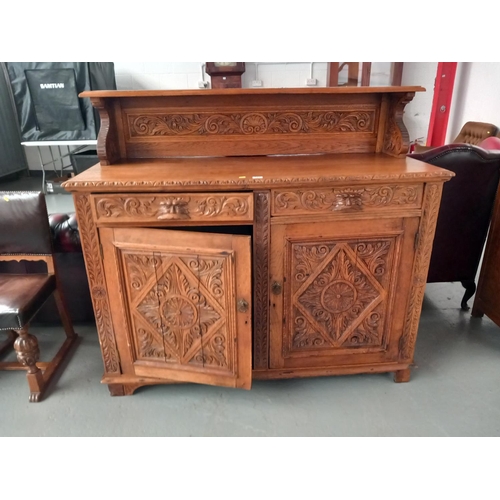 127 - An oak carved buffet/sideboard