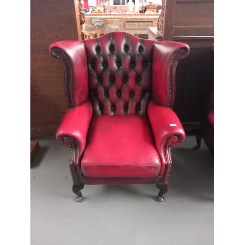 130 - Red leather Chesterfield wingback armchair