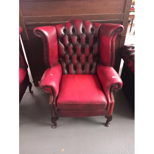 131 - Red leather Chesterfield wingback armchair