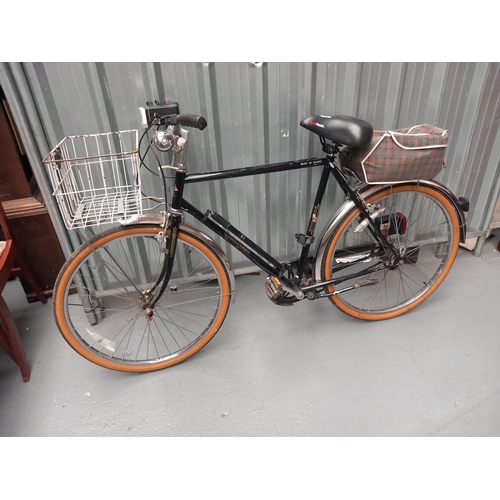 136 - A vintage Peugeot gentleman's bicycle with basket attachment