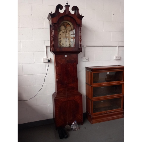 138 - A mahogany cased grandfather clock with weights and pendulum