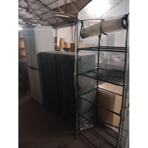 347 - 3 plastic garden storage containers and a greenhouse
