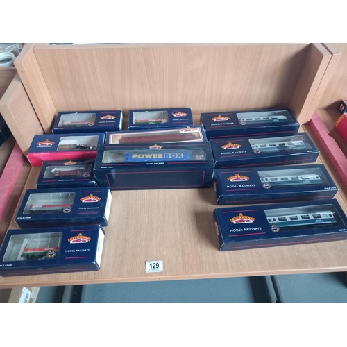 129 - Nine various boxed Bachmann OO gauge wagons and four barrier vehicle carriages