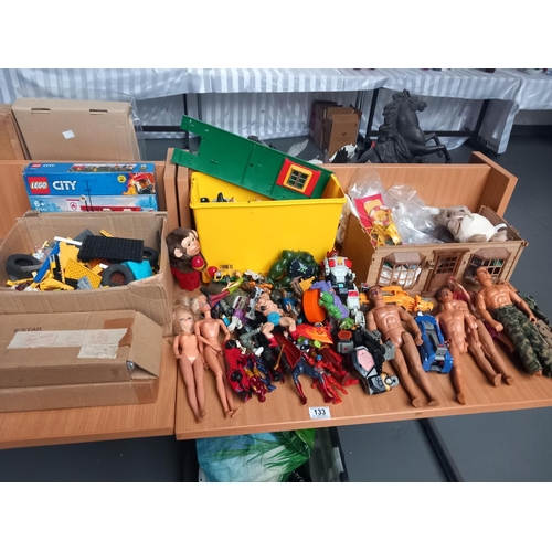 133 - A selection of toys and games to include Action Man figures, Lego, etc