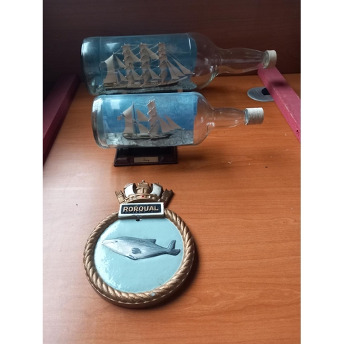 137 - Two model ships in glass bottles and an aluminium plaque believed to be from a ship