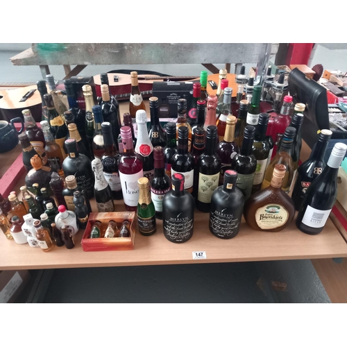 147 - A collection of alcohol to include vodka, gin, port, etc