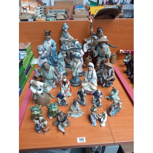 165 - A selection of oriental style figurines to include Nao and LLadro