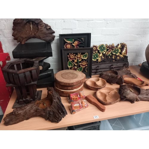 171 - A selection of wooden bowls, plaques, driftwood clocks, a book display stand, etc